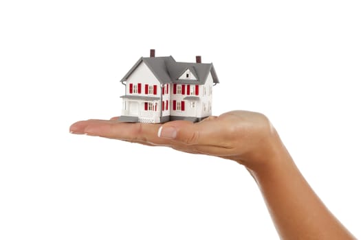 Model House in Female Hand Isolated on a White Background.
