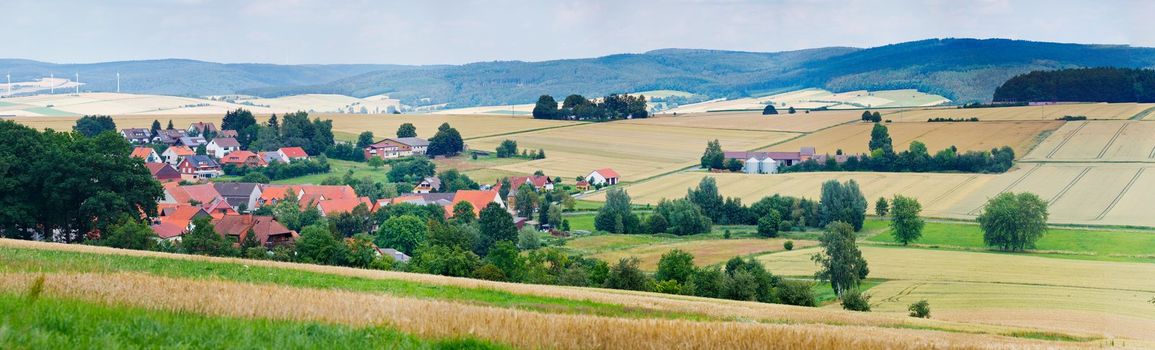 Summer German landscape - houses, hills, river. Panorama