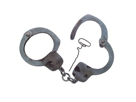 Old handcuffs and DIY key on white background