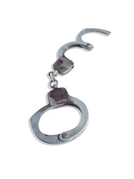 Old handcuffs on white background