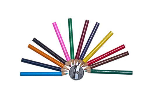Semicircular of color pencils encircle the sharpener