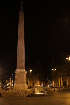 An Egyptian Obelisk of Ramesses II, located in Piazza del Popolo, Rome, Italy.   Shot at night.
