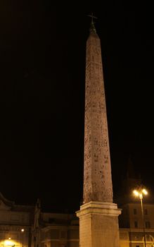 An Egyptian Obelisk of Ramesses II, located in Piazza del Popolo, Rome, Italy.   Shot at night.