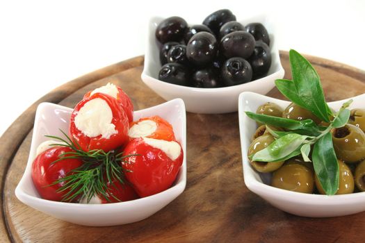 stuffed peppers with cream cheese and olives with dill and olive branch