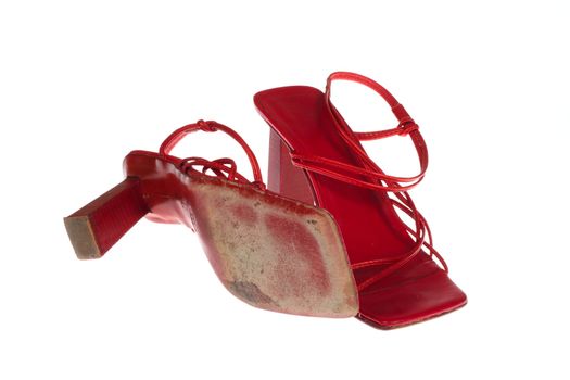 Old red shoes photo on the white background