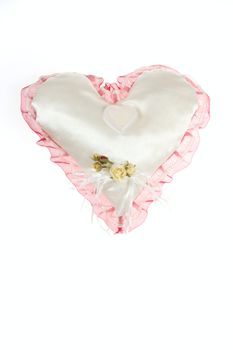 Wedding ornaments ring on pillow in shape of heart