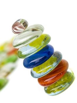 balanced colorful stones isolated on white background
