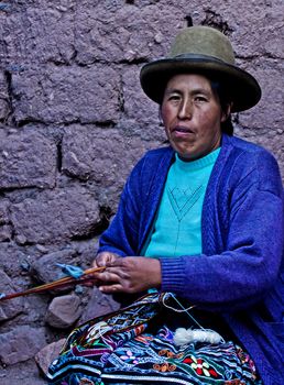 Cusco , Peru - May 26 2011 : Quechua Indian woman weaving with strap loom