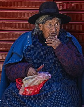 Cusco , Peru - May 27 : Peruvian woman in a market in Cusco Peru , May 27 2011