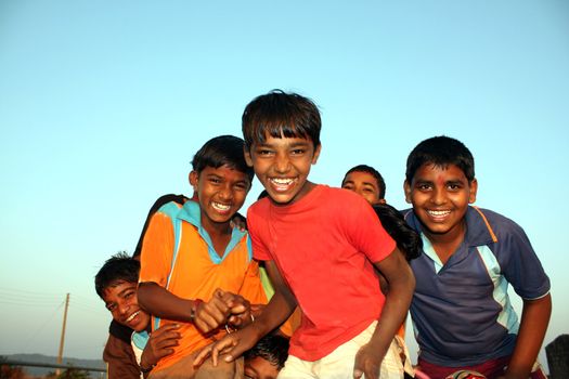 Poor kids from India in a happy mood.