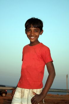 A little Indian teenage boy from rural and poor parts of India.