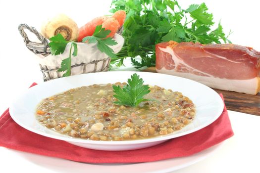 Lentil soup with potatoes, bacon and fresh parsley