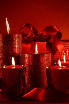 Red Christmas candles on vintage background