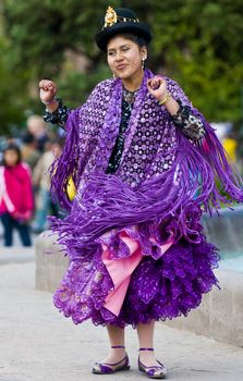 Cusco , Peru - May 25  : Peruvian dancer with traditional clothes dancing in street in Cusco Peru on May 25 2011