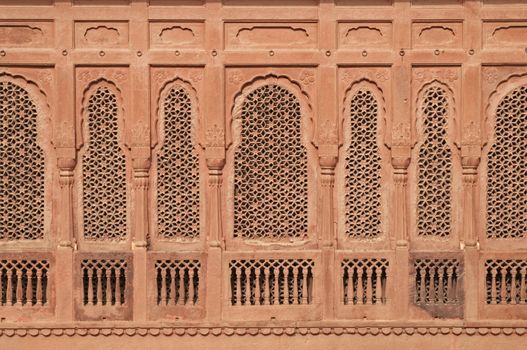 Elaborately carved red sandstone windows of Junagarh Fort in Bikaner, Rajasthan, India