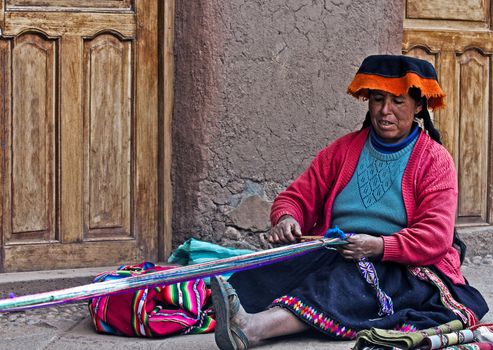 Cusco , Peru - May 26 2011 : Quechua Indian woman weaving with strap loom