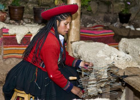 Cusco , Peru - May 26 2011 : Quechua Indian woman weaving 