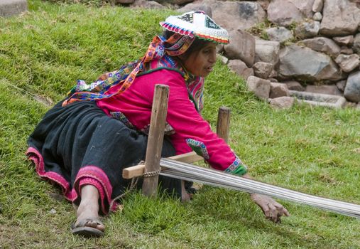 Cusco , Peru - May 26 2011 : Quechua Indian woman weaving with strap loom