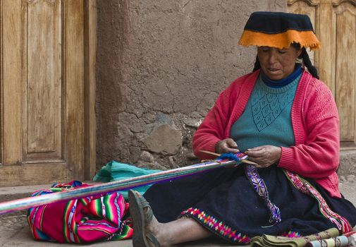 Cusco , Peru - May 26 2011 : Quechua Indian woman weaving with strap loom