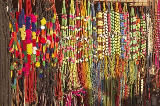 Market stall selling colorful bridles for livestock at the Nagaur Cattle Fair in Rajasthan, India