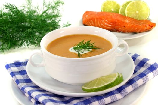 Salmon cream soup with a dollop of cream and dill