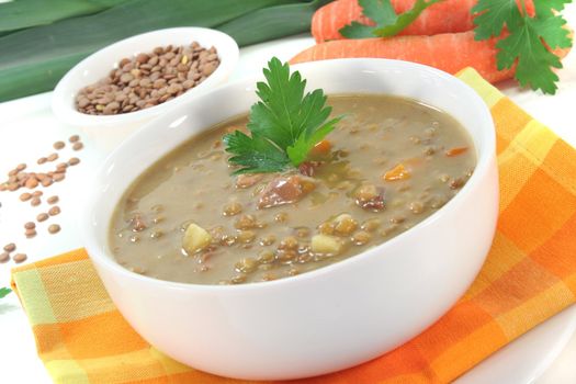 Lentil soup with potatoes, bacon and fresh parsley