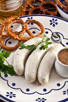 weisswurst with sweet bavarian mustard and pretzels