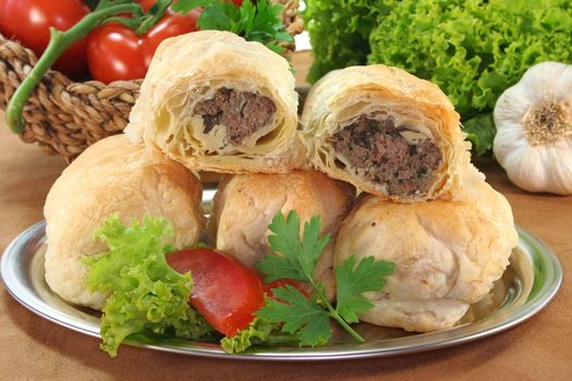 Arab meat mince pie with fresh lettuce, tomatoes and parsley