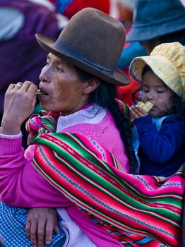 Cusco , Peru - May 28 2011 : Peruvian woman with here child in a market in Cusco Peru