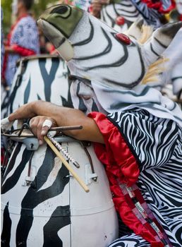 MONTEVIDEO,URUGUAY-FEBRUARY 5 2011: Candombe drummer in the Montevideo annual Carnaval ,  Candombe is a drum-based musical style of Uruguay. Candombe originated among the African population in Montevideo Uruguay