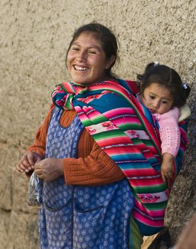 Cusco , Peru - May 28 2011 : Peruvian woman with here child in a market in Cusco Peru