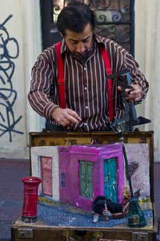 BUENOS AIRES  , ARGENTINA  - APR 24 2011 : Puppeteer in a street puppet show in Buenos aires Argentina  