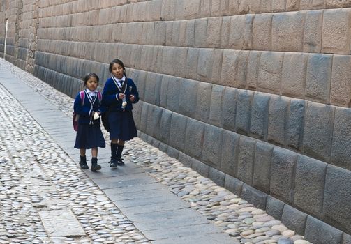 Cusco , Peru - May 25 :  Peruvian school students walk in the narrow alleys of  Cusco Peru 