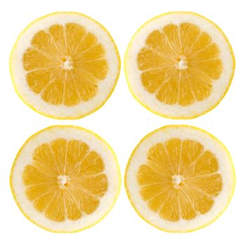 Four fresh lemon halves on white background.