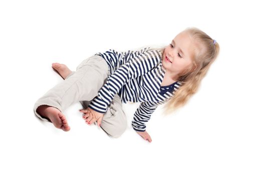 Shot of little cute girl with long hair in studio