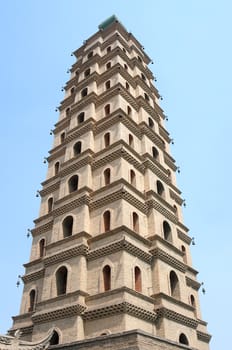 Bottom view of a historic pagoda in China against blue sky