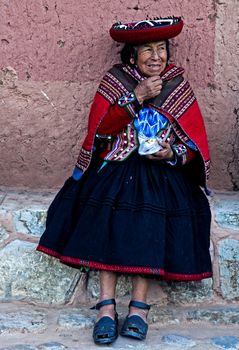 Cusco , Peru - May 26 :  Peruvian woman seat in the narrow alleys of  Cusco Peru 