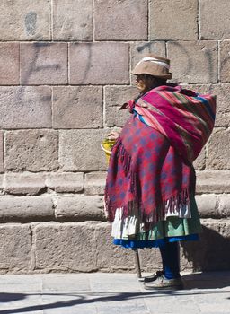 Cusco , Peru - May 28 :  Peruvian woman walk in the narrow alleys of  Cusco Peru 