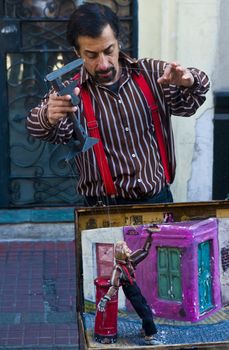 BUENOS AIRES  , ARGENTINA  - APR 24 2011 : Puppeteer in a street puppet show in Buenos aires Argentina  