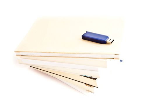 Concept of memories: blue usb key close to books