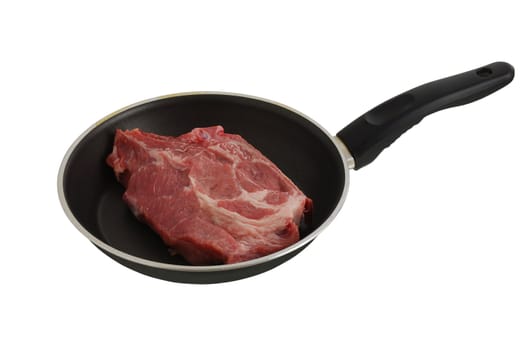 One raw steak in frying pan isolated on white background