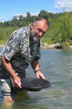 prospector panning for gold in rivers in France in the Gard region