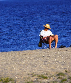Man enjoying the summer sun at a local beach
