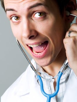 Happy young doctor with a stethoscope