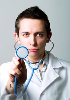 Young doctor using a stethoscope