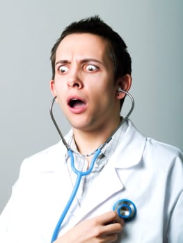Young doctor using a stethoscope