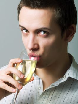 Young man drinking champaign
