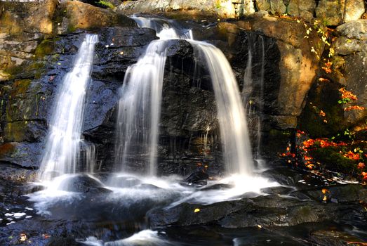 A beautiful waterfall during the autumn season