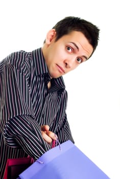 Young man holding shopping bags