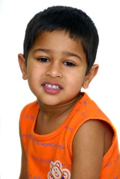 an handsome Indian kid not looking happy